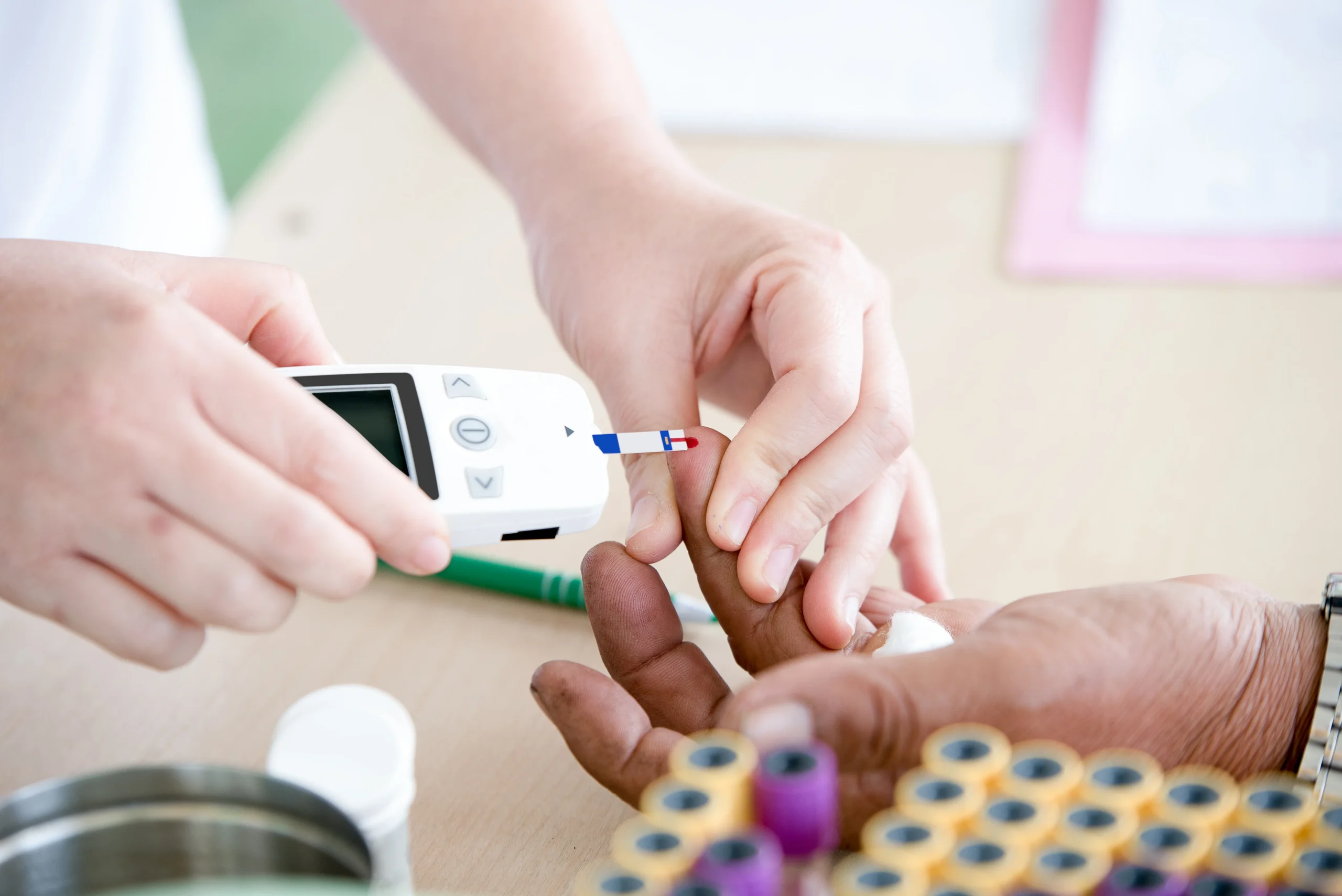 Doctor checking patient’s hands for diabetes.